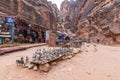 Tourists view souvenirs in Bedouin Petra shop in Petra near Wadi Musa city, Jordan