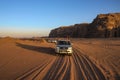 Wadi Rum desert Jordan, on 17-09-2017. The whole in beautiful sunset light, where Bedouin in convoy drive visitors of the desert i