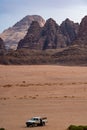 Camel and jeep in the Wadi Rum desert in Jordan