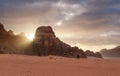 Wadi Rum desert landscape in sunrise. a man walking alone in Wadi Rum desert in Jordan, Middle-East Royalty Free Stock Photo