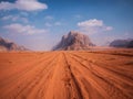 Wadi Rum in Jordan. Beautiful landscape of desert. Red desert. Wheel marks. Desert road.