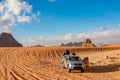 Jordan, Wadi Rum desert, people and cars on safari