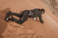 Wadi Rum, Jordan - 2019-04-23 - Man draws intricate patterns in the sand dune