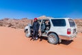 WADI RUM, JORDAN - MARCH 26, 2017: 4WD Toyota with a local Bedouin tour guide in Wadi Rum desert, Jord Royalty Free Stock Photo