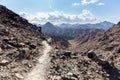 Wadi Shawka narrow hiking trail in rocky limestone Hajar Mountains, United Arab Emirates.