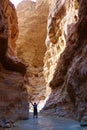 Young adventurous man in Wadi Zarqa Ma`in canyon located in the mountainous landscape to the east of the Dead Sea, near to Wadi M