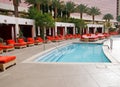 Wading Pool at Resort with Orange Chaise Lounges Royalty Free Stock Photo