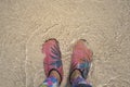 Wading shoes of woman standing on the beach sand, beach of Krabi , Thailand Royalty Free Stock Photo