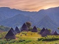 Wae Rebo traditional village with a mountainous backdrop in the morning.