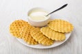 Wafer cookies, bowl with condensed milk, spoon in white plate Royalty Free Stock Photo