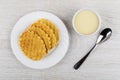 Wafer cookies in plate, bowl with condensed milk and teaspoon Royalty Free Stock Photo