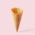 Wafer ice cream cone on a light pink background. Minimalistic concept Royalty Free Stock Photo