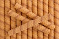 Wafer roll sticks as background, view from above. Royalty Free Stock Photo