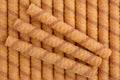 Wafer roll sticks as background, view from above. Royalty Free Stock Photo