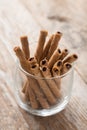 Wafer roll sticks cream rolls in a cup on the table. Royalty Free Stock Photo