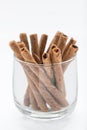 Wafer roll sticks cream rolls in a cup on white background. Royalty Free Stock Photo