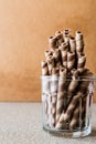 Wafer rolls in glass cup. Barquillos Royalty Free Stock Photo