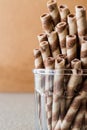 Wafer rolls in glass cup. Royalty Free Stock Photo