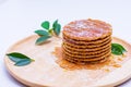 Wafer sprinkled with honey on wooden tray ready to serve Royalty Free Stock Photo