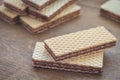 Wafers with chocolate on wooden table Royalty Free Stock Photo