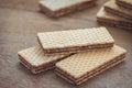 Wafers with chocolate on wooden table Royalty Free Stock Photo