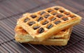 Wafers with coffee beans on a bamboo mat