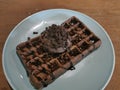 Waffel with chocolate syrup and chocolate ice cream with choco chip