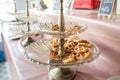 Waffle for Breakfast on the Buffet Table. Miniature Waffles in a Warming Tray with Tongs at a Buffet in a Restaurant. Royalty Free Stock Photo