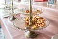 Waffle for Breakfast on the Buffet Table. Miniature Waffles in a Warming Tray with Tongs at a Buffet in a Restaurant. Royalty Free Stock Photo