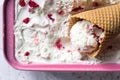 Waffel cornet filled with homemade Ice cream made with Greek yogurt and raspberry. Summer refreshment and healthy dessert. Recipe