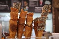 Waffle cones with chocolate and nuts for ice-cream on the counter Royalty Free Stock Photo