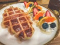 waffle with cream and strawberries blueberries