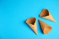 Waffle empty ice cream cones, flat lay. Space for text Royalty Free Stock Photo