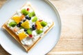 Waffle Fruity Kiwi Strawberry Blueberry Dessert. Fruity dessert food and drink category. Colorful Waffle Fruity. Close up shot. Royalty Free Stock Photo