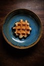 Waffle in handmade clay plate