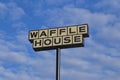 Waffle house sign on a beautiful day