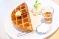 Waffle with maple syrup and butter