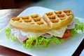 Waffle sandwich with ham and cheese Served