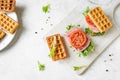 Waffle sandwich with ham and tomato