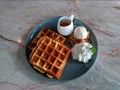 Waffle with syrup waffle with ice-cream waffle with strawberry waffle with whip cream waffle on wooden table yummy waffle fresh wa