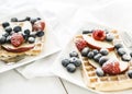 Waffles with apple, raspberry and blueberries