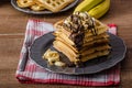 Waffles with bananas, nuts and chocolate Royalty Free Stock Photo