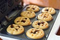 Waffles in the circular mold of a small electric waffle maker are easy to make yourself. Royalty Free Stock Photo