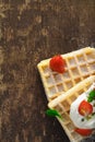 Waffles with cream and strawberries Royalty Free Stock Photo