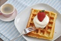 Waffles with cream and strawberries Royalty Free Stock Photo