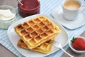 Waffles with cream and strawberries Royalty Free Stock Photo