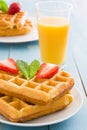 Waffles with ice cream on a blue wooden table Royalty Free Stock Photo