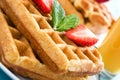 Waffles with ice cream on a blue wooden table Royalty Free Stock Photo