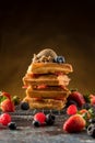 Waffles with ice cream, caramel sauce and fresh berries. Delicious Waffle with berry and ice cream at cafe. Royalty Free Stock Photo