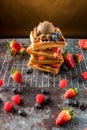 Waffles with ice cream, caramel sauce and fresh berries. Delicious Waffle with berry and ice cream at cafe. Royalty Free Stock Photo